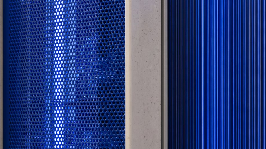 Blue-lit server racks in a data hall