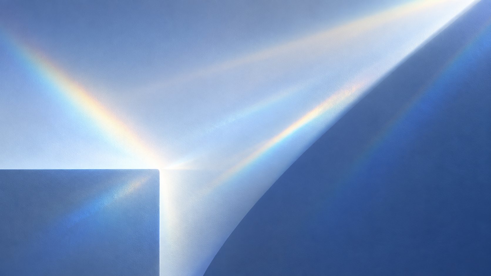 Light refracting across a blue glass surface